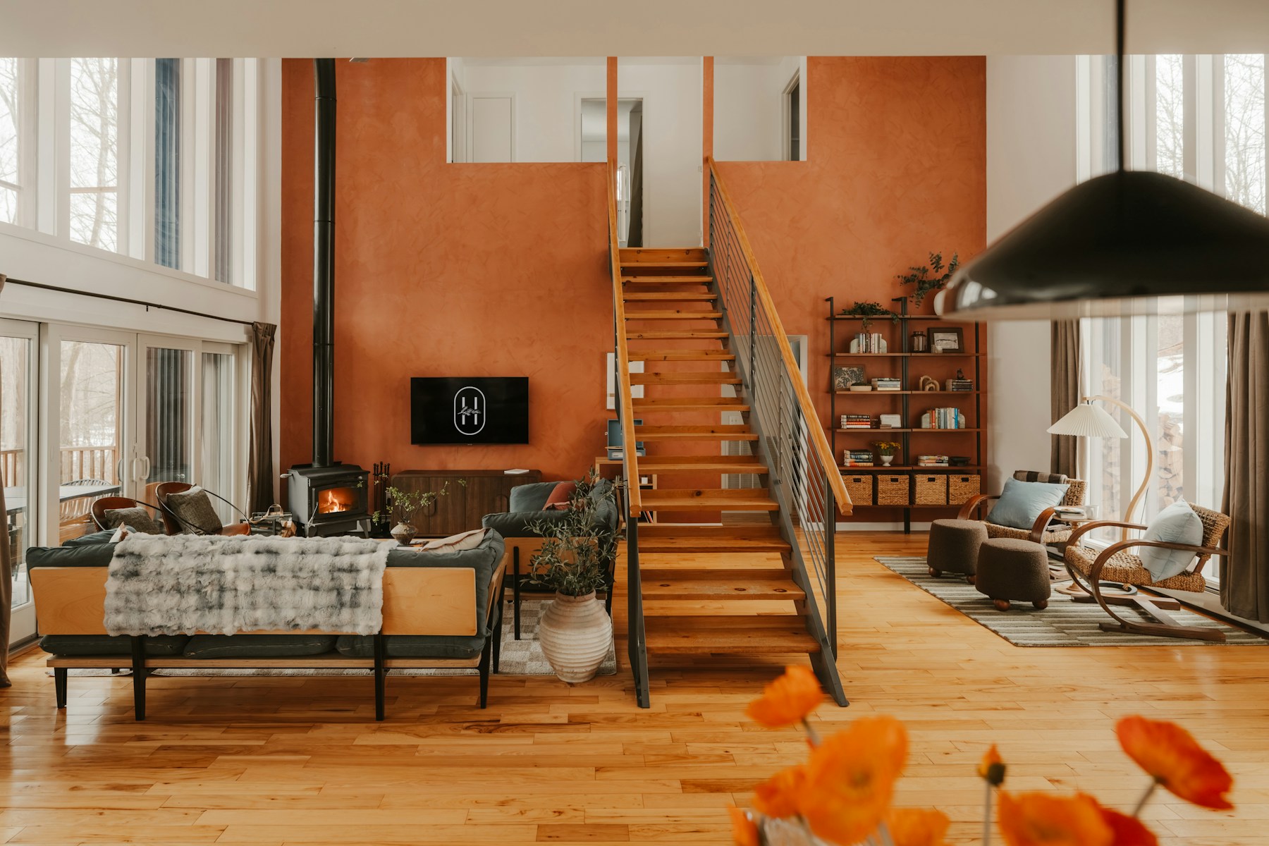 Stock photo of a renovated living space with wood floors and a staircase; not I-75 work